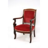 A pair of 19th Century mahogany elbow chairs, with upholstered seats and back panels,