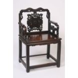 A Chinese hardwood throne chair, having shaped top rail above a carved and pierced back panel,