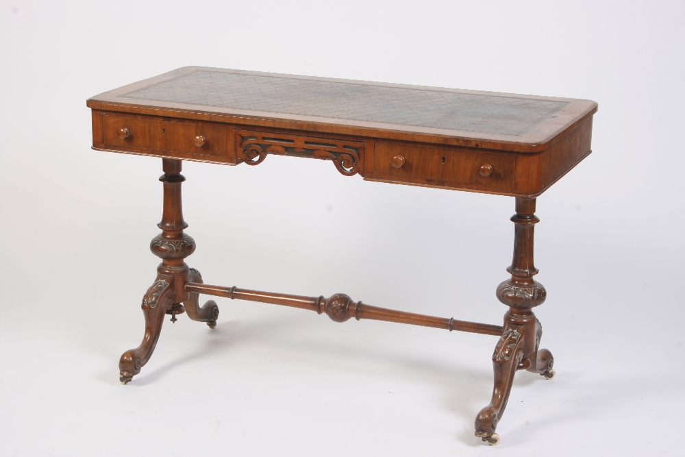 A Victorian walnut writing table,