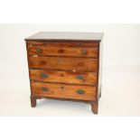 A George III mahogany bachelor's chest, fitted brushing slide and four long graduated drawers below,