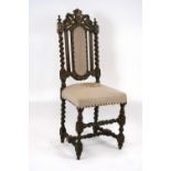 A Victorian oak hall chair, with carved beast and leaf decoration above spiral columns,
