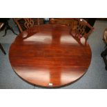A 19th Century mahogany circular snap top dining table,