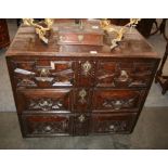 An Antique oak chest, the moulded top above three long graduated and geometrically moulded drawers,