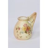 A Royal Worcester cream jug, having foliate spray painted decoration on a blush ivory ground,