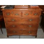 A Georgian oak chest, fitted two short and three long graduated drawers,