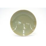 A 20th Century Chinese celadon ground charger, 36.5cm dia.