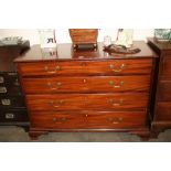A George III mahogany chest, of four long graduated drawers fitted with brass swan neck handles,