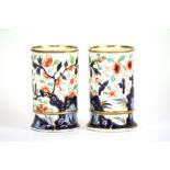 A pair of 19th Century English porcelain spill vases, decorated in the Imari palette, 10.