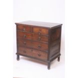 An 18th Century oak panelled chest,