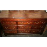 An 18th Century oak and mahogany cross-banded mule chest,