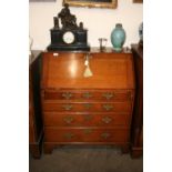 An 18th Century oak bureau, of small proportions,