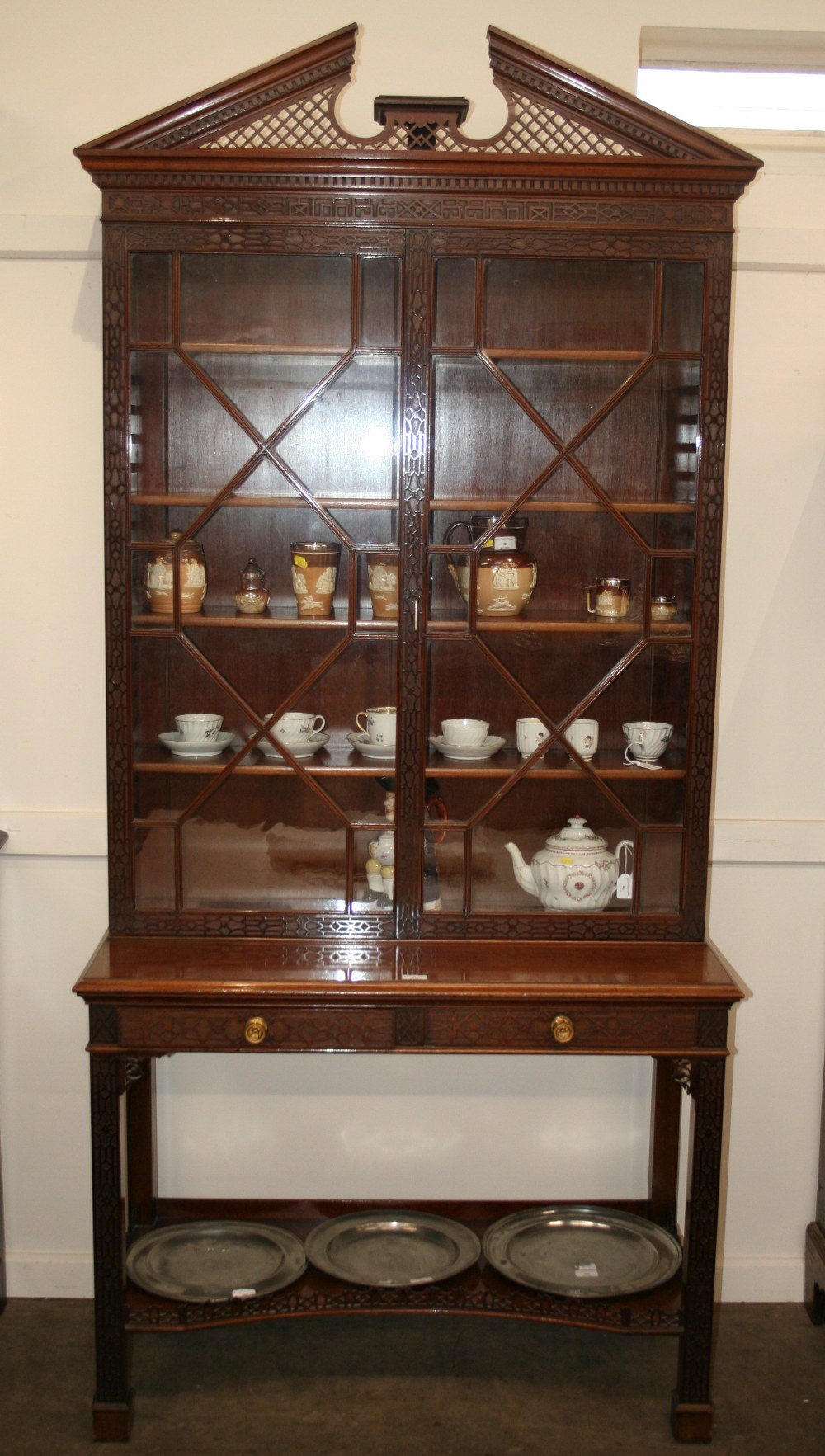 A 19th Century mahogany display cabinet on stand, by Edwards & Roberts,