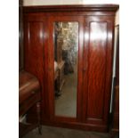 A Victorian mahogany triple wardrobe, fitted sliding trays,