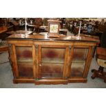 A Victorian walnut and inlaid credenza, of breakfront form, having gilt  metal mounts,