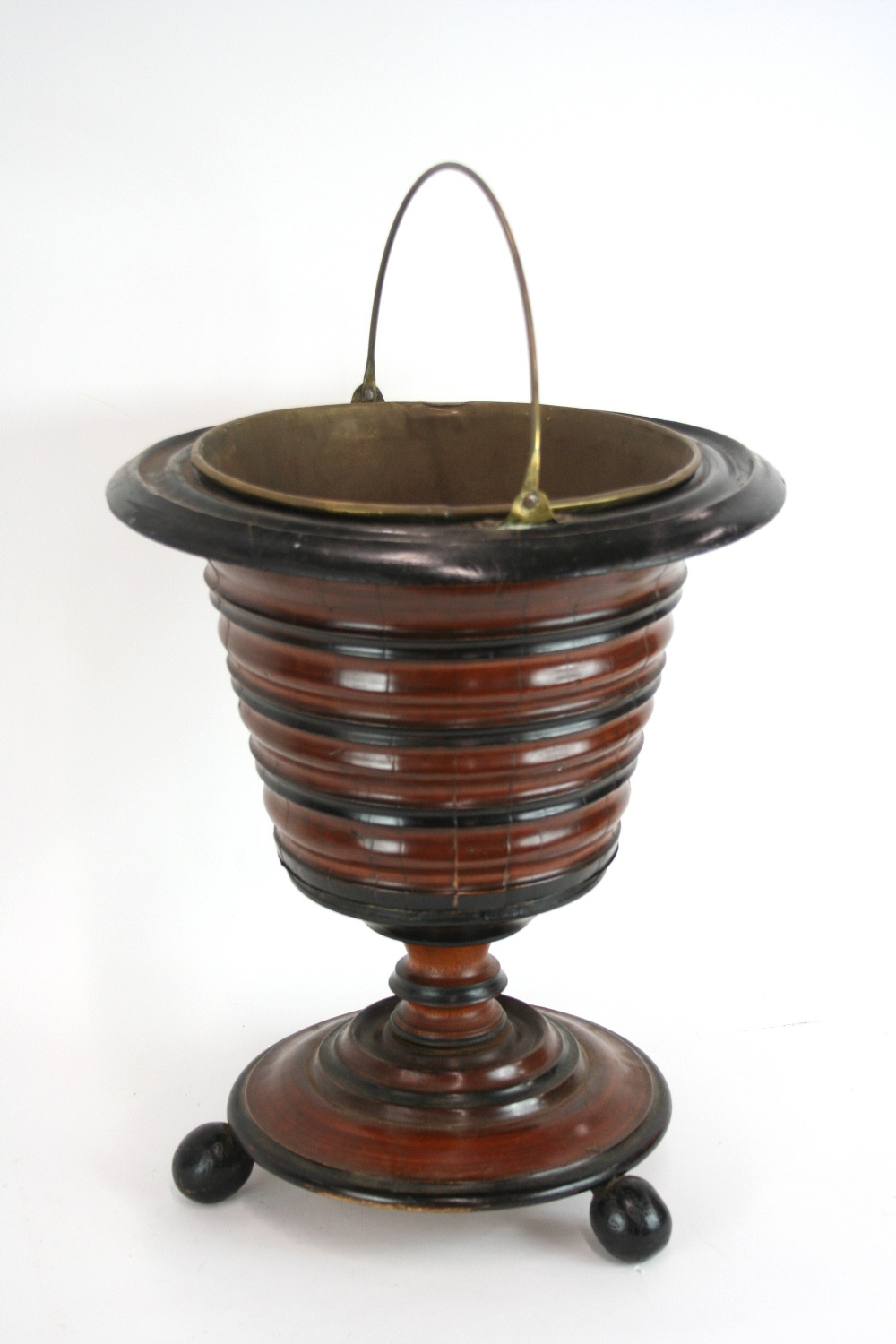 A Dutch mahogany and ebony banded coal bucket, of segmented form with brass liner,