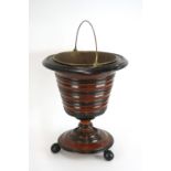 A Dutch mahogany and ebony banded coal bucket, of segmented form with brass liner,