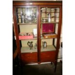 An Edwardian inlaid mahogany china display cabinet, enclosed by a pair of glazed panel doors,