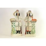 A pair of Victorian large Staffordshire figures of huntsmen,