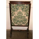 A 19th Century mahogany fire screen, with sliding sections,