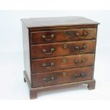 A George III mahogany bachelor's chest, fitted brushing slide and four long graduated drawers,