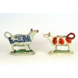 A Staffordshire lustre decorated cow creamer,16cm long; and another decorated in the willow pattern,