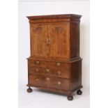 An 18th Century walnut cabinet on chest,