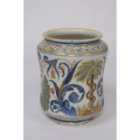 A Majolica Alberello shaped jar, decorated brightly coloured stylised banding and scrolling flowers,