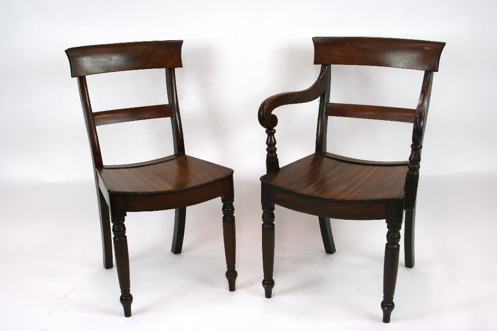 A set of 8 early 19th Century mahogany bar back dining chairs, with solid seats,