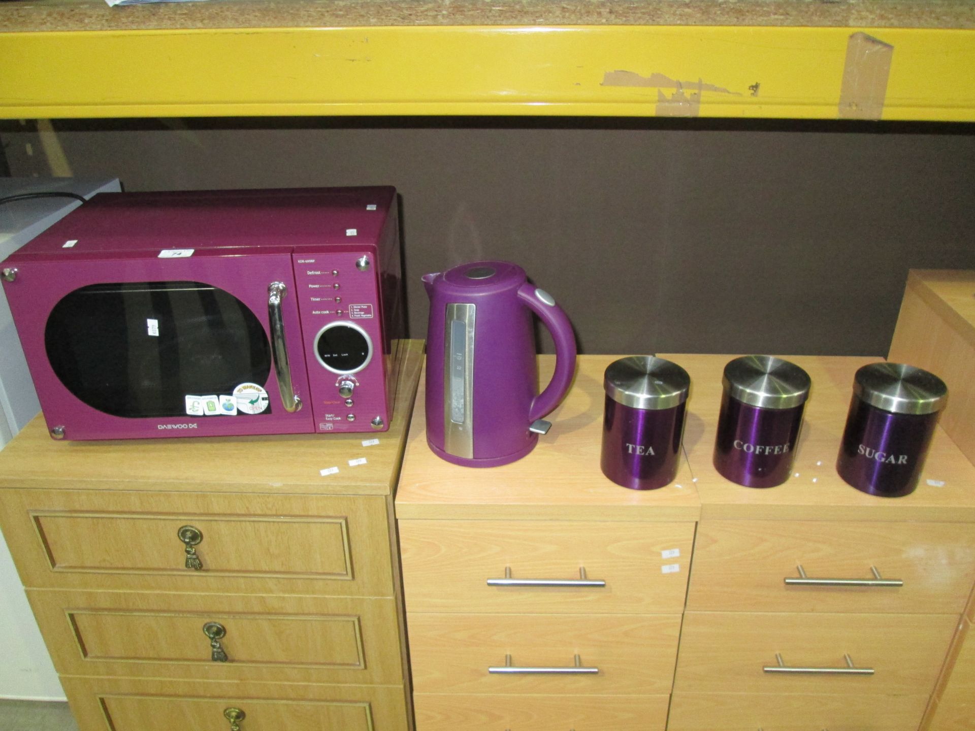 5 x items - Daewoo purple microwave oven, purple kettle and 3 x purple tea, coffee and sugar pots