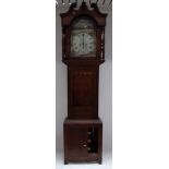 A long-case clock in an oak and mahogany