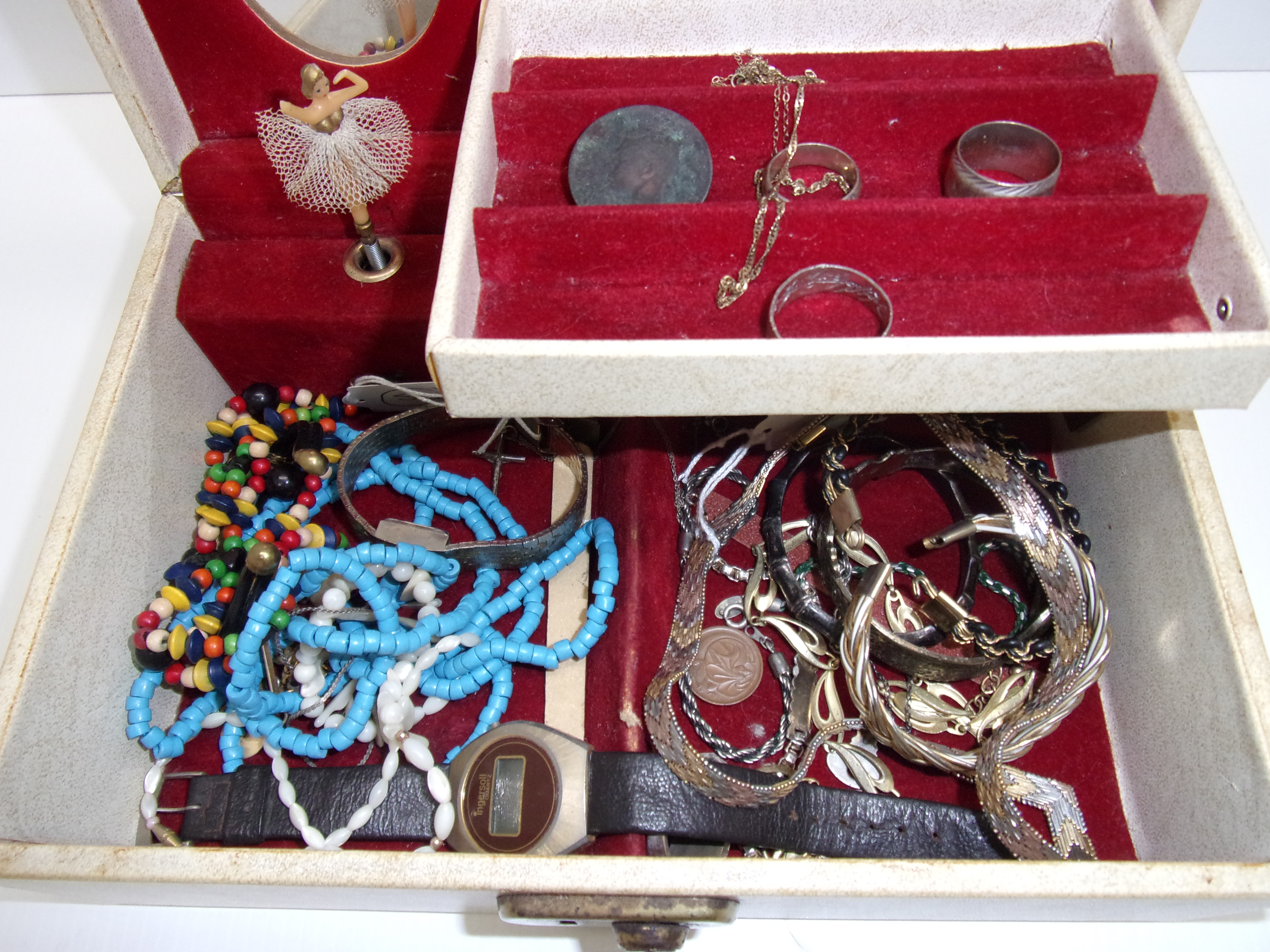 A jewel box containing bracelets, neckla