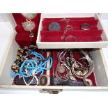 A jewel box containing bracelets, neckla