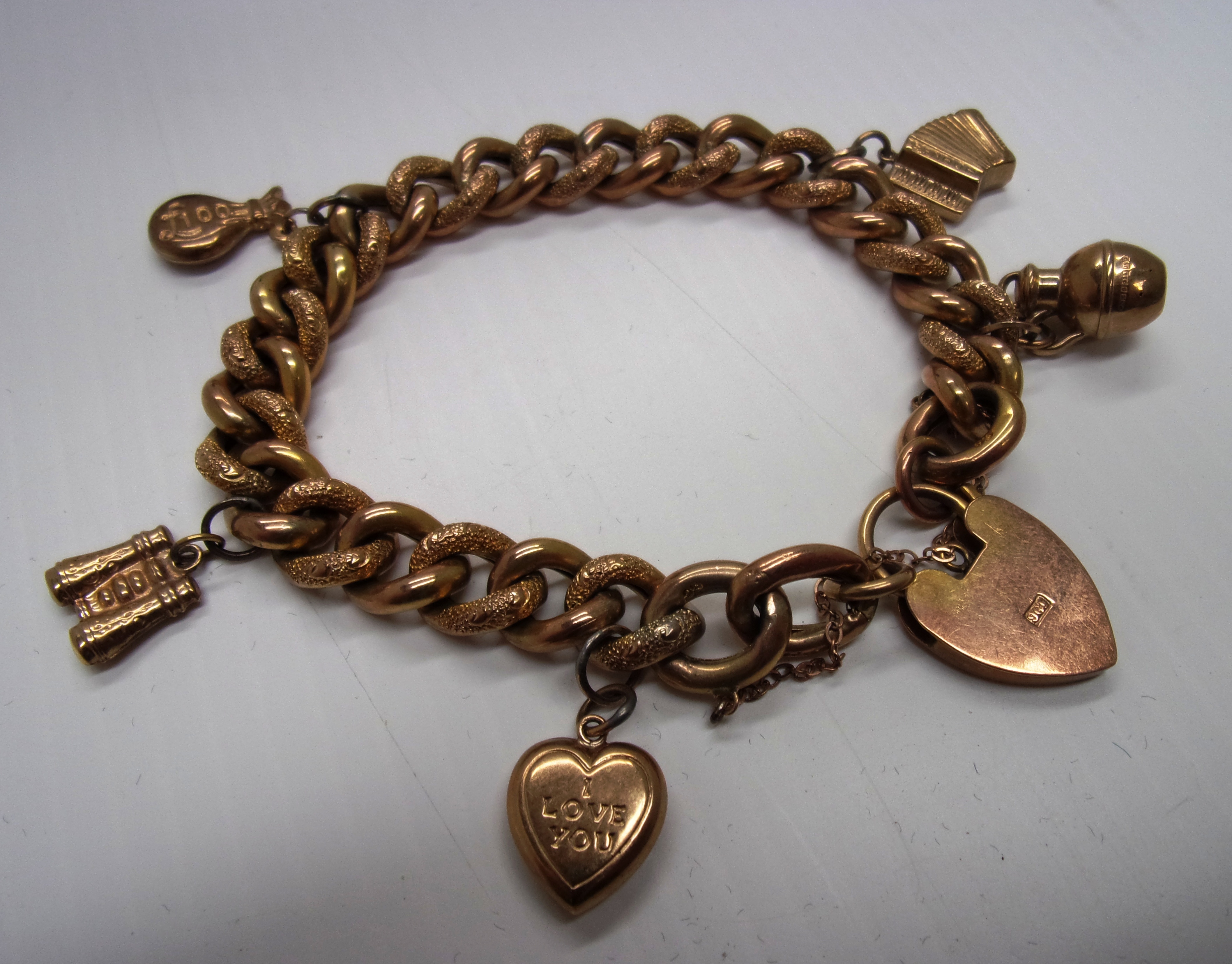 A 9ct gold bracelet of textured curb lin