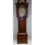 A long-case clock in an oak and mahogany