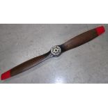 A stained wood aeroplane propellor with