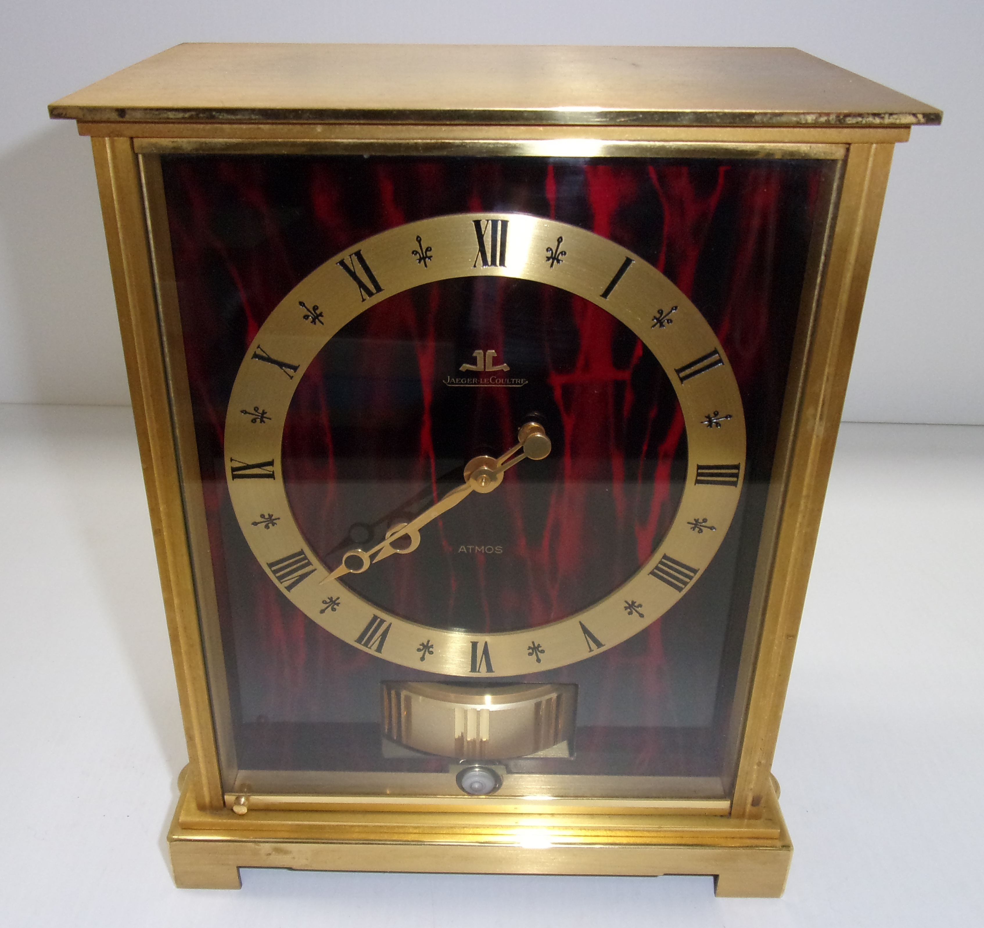 A Jaeger-LeCoultre Atmos Embassy model clock in a brass framed case with simulated tortoiseshell