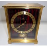 A Jaeger-LeCoultre Atmos Embassy model clock in a brass framed case with simulated tortoiseshell