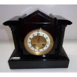 A late 19th century mantel clock in a bl