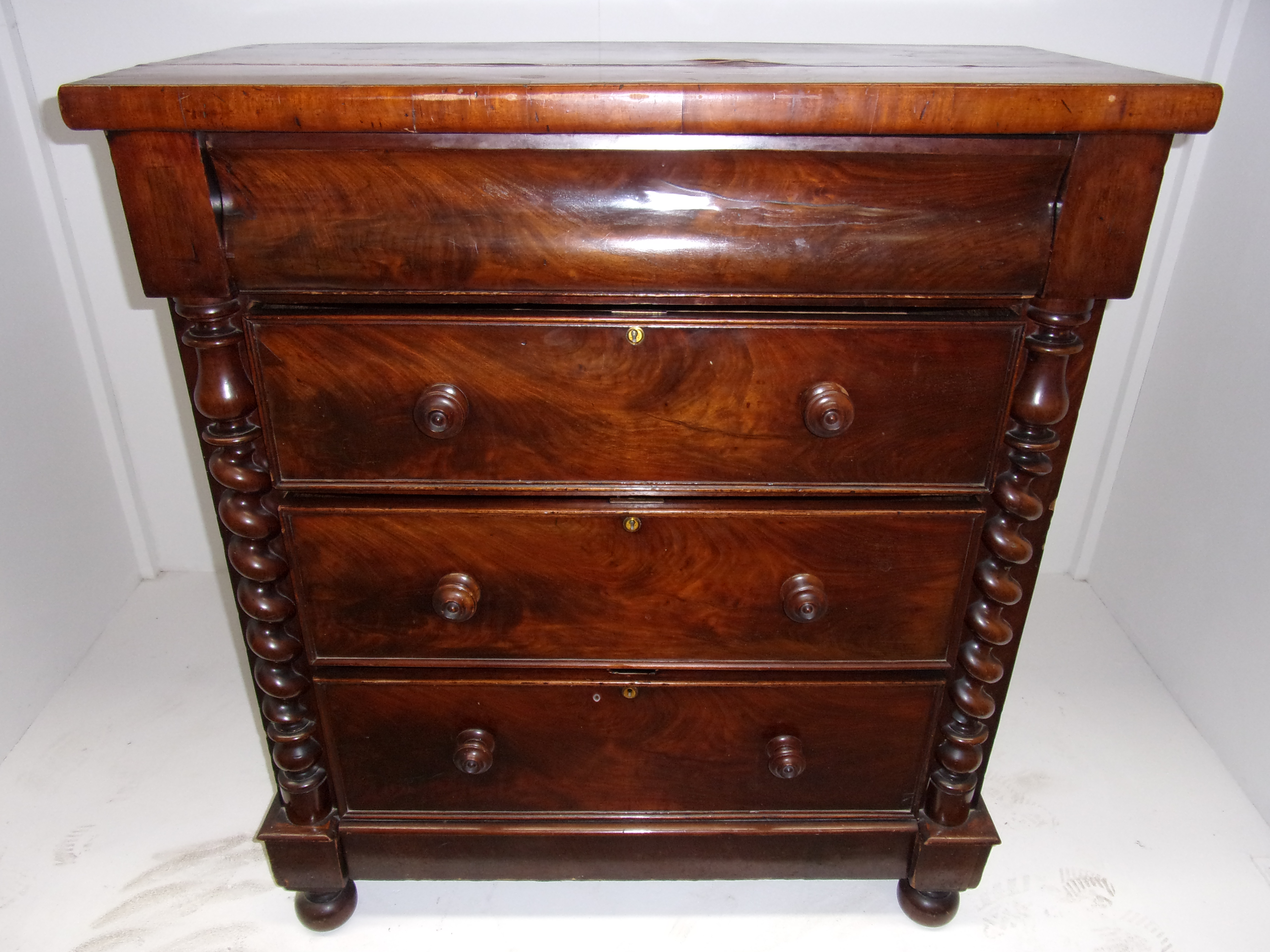 A Victorian mahogany chest of serpentine