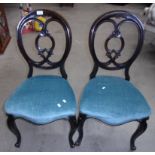 Pair of mahogany oval back side chairs.