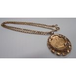 A 1976 sovereign pendant in a 9ct floral