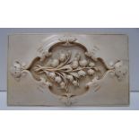 A rectangular ivory book cover carved wi
