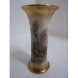 A Royal Worcester waisted cylindrical vase, painted with pheasants in a landscape and signed Jas.
