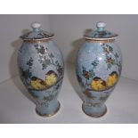 A pair of Carlton ware pottery baluster