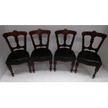 A set of four Edwardian mahogany dining