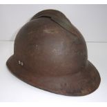 A French metal helmet with applied centr