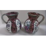 A pair of Victorian pottery ewers with b