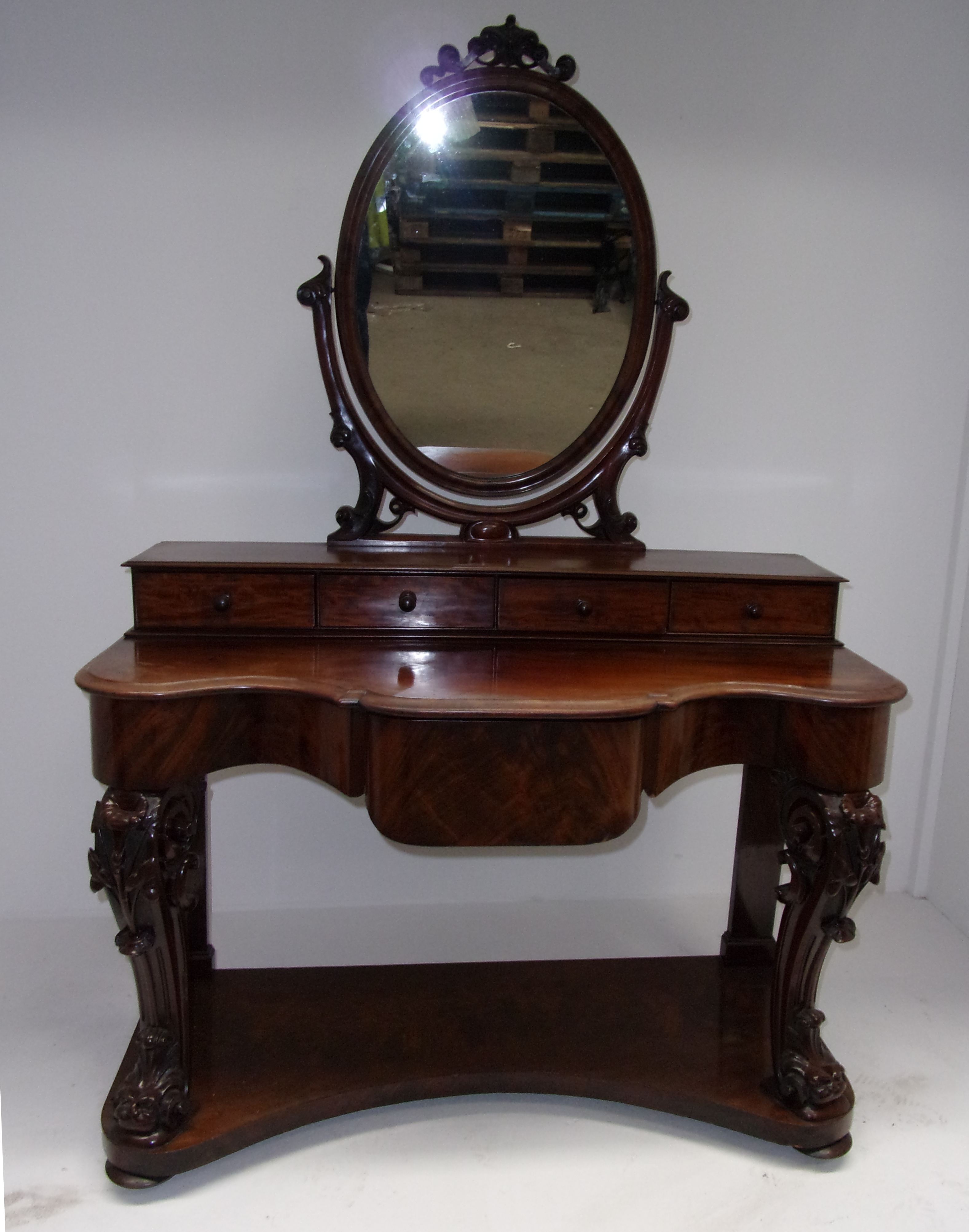 A Victorian mahogany Duchess dressing table with oval mirror over four drawers, shaped front and - Image 2 of 4