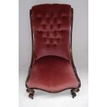 A Victorian mahogany nursing chair with