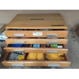 A four drawer oak chest labelled Meccano